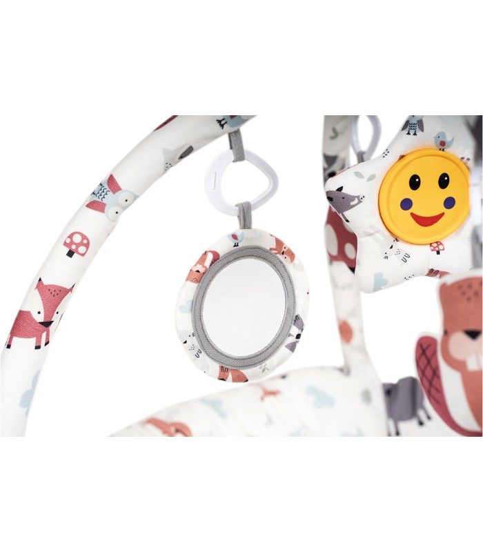 Alfombra de actividades Olmitos con arco acolchado, espejo redondo y sol sonriente de peluche en tonos rosa y gris.