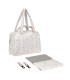 Bolso de maternidad Nalea de Lässig blanco con estampado, incluye cambiador y ganchos para el carrito.