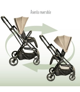 Silla Eolia Niu con chasis negro y capota beige, mostrando su asiento reversible en ambas direcciones.