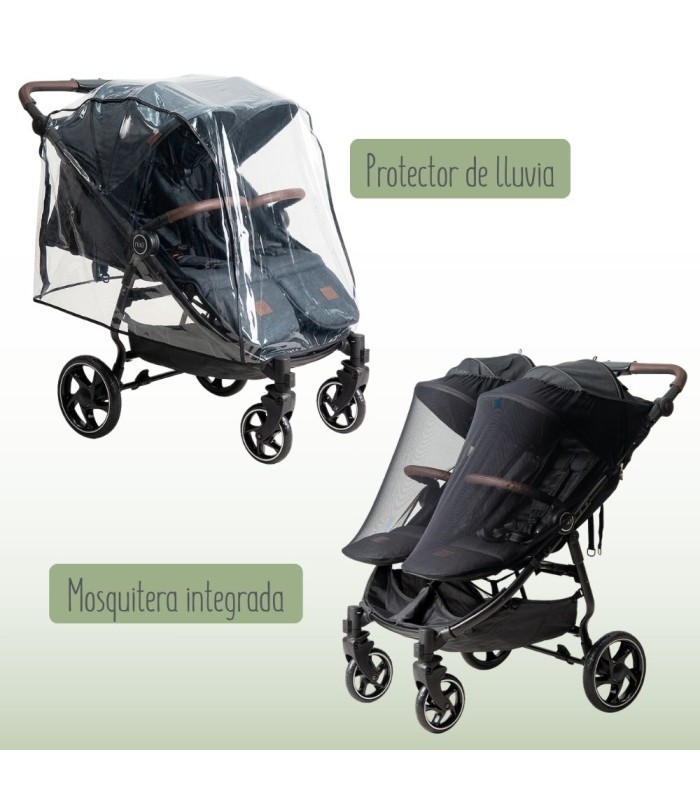 Silla gemelar VentTwin negra con burbuja de lluvia transparente y mosquitera sobre chasis de cuatro ruedas.